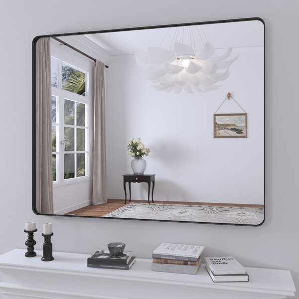 Mirror with towel bar outlet